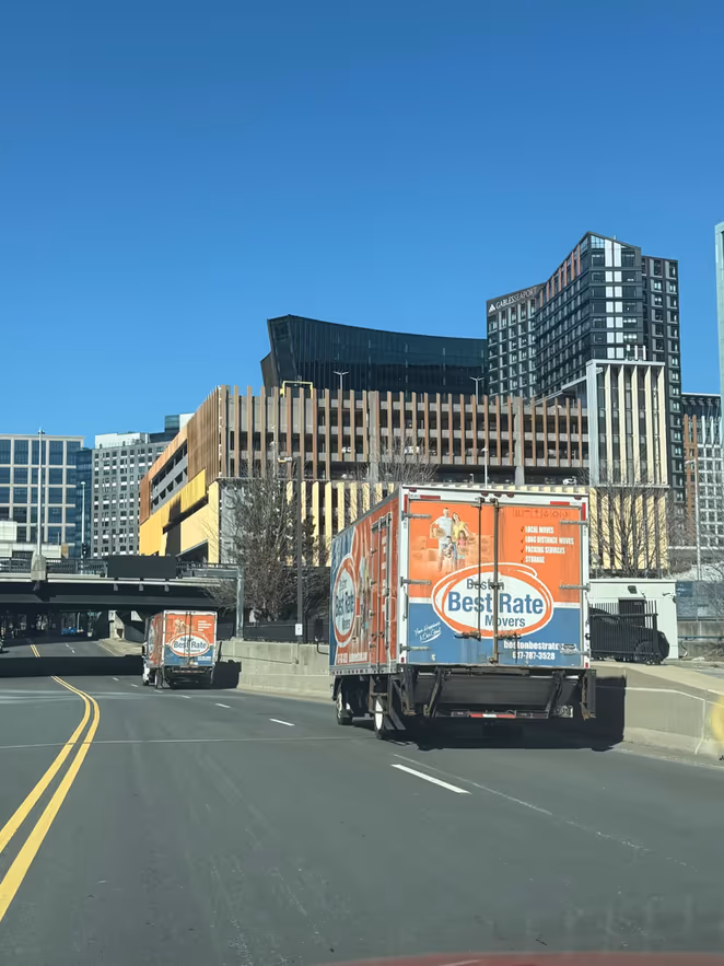 Boston Best Rate Movers trucks driving on Boston highway