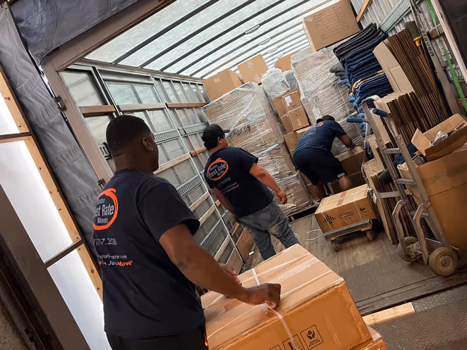 BBRM crew organizing and loading boxes inside moving truck
