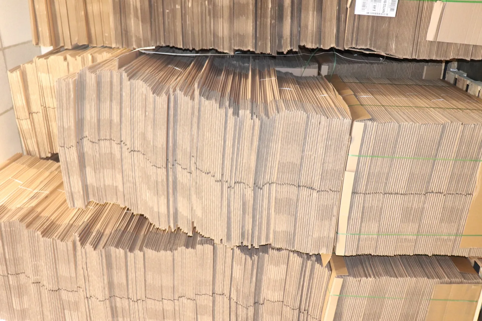 Flat moving boxes stacked in storage