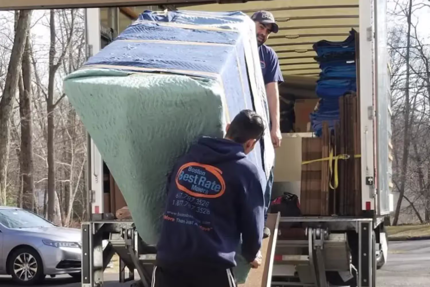 Appliance movers handling refrigerators and washers