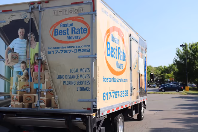 Experienced Boston movers loading a large moving truck