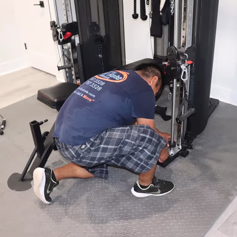 Gym equipment being moved by BBRM crew