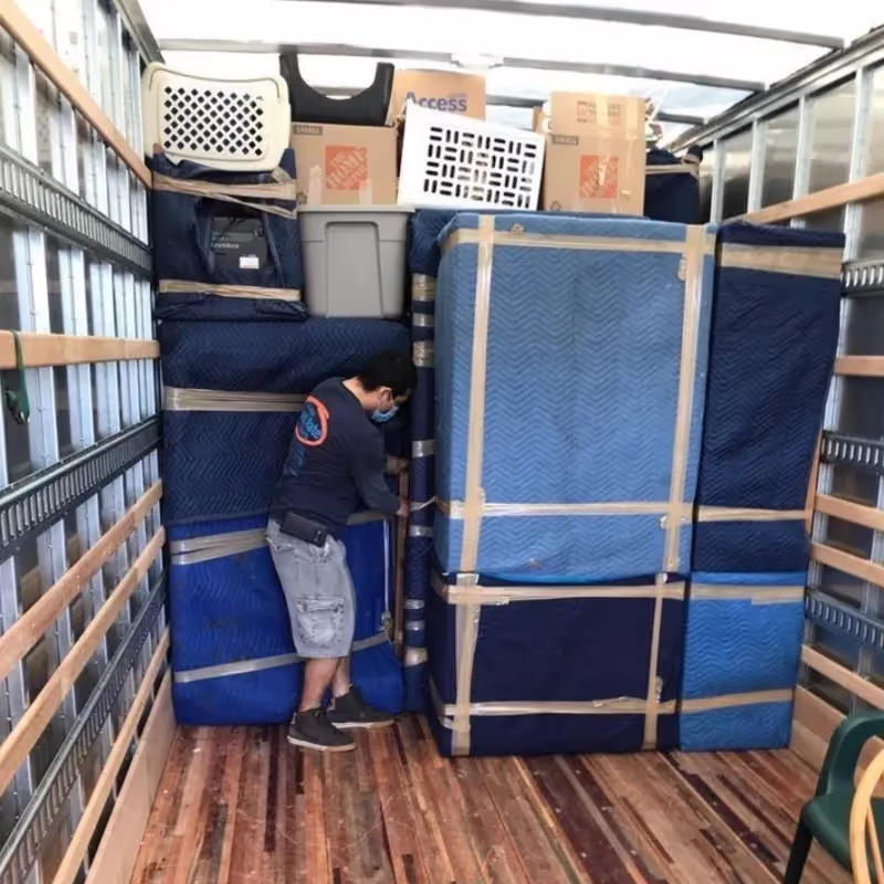 Boston Best Rate Movers team organizing a storage unit